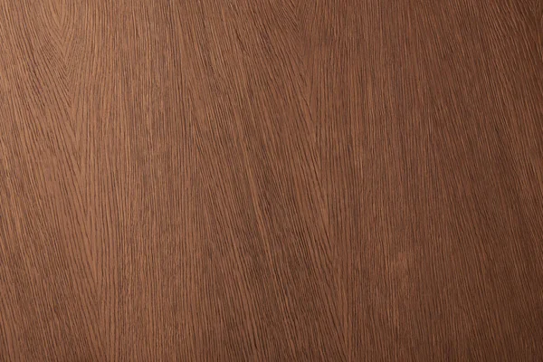 Vue de dessus de la surface de bureau marron avec texture en bois — Photo de stock