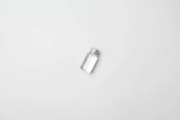 Top view of transparent cometic bottle on white background with copy space — Stock Photo