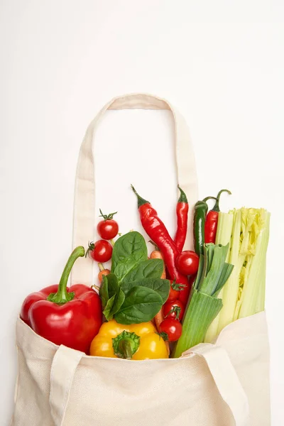 Studio shot of eco bag with natural vegetables on white background — Stock Photo