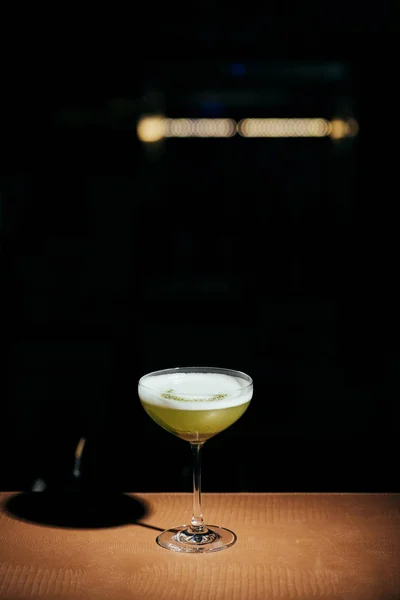 Selective focus of delicious cocktail with foam on black background with copy space — Stock Photo