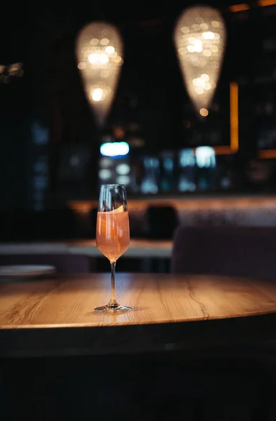 Selective focus of pink alcoholic cocktail on dark background with copy space — Stock Photo