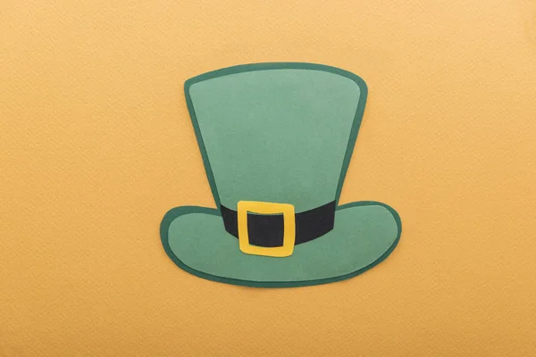 Top view of paper hat isolated on orange, st patrick day concept — Stock Photo