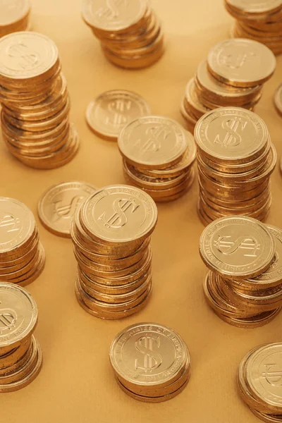 Rows of golden coins with dollar signs isolated on orange, st patrick day concept — Stock Photo