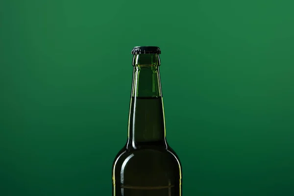 Beer bottle isolated on green with copy space, st patrick day concept — Stock Photo