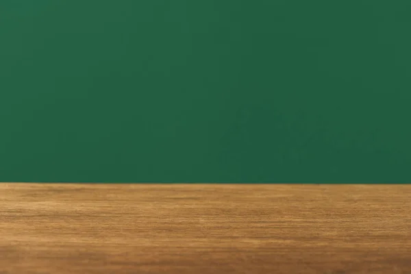 Empty wooden table on green background with copy space — Stock Photo