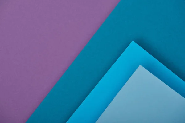 Top view of purple and blue paper sheets with copy space — Stock Photo