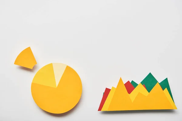 Top view of chart and graphs made of paper on white background — Stock Photo