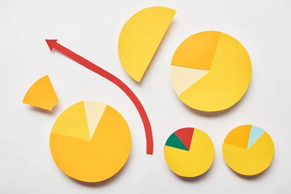 Top view of paper pointer and charts on white background — Stock Photo