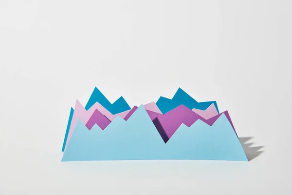 Blue and purple paper graphs on white background — Stock Photo