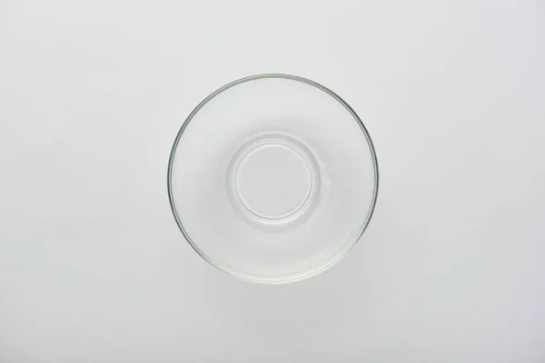 Top view of transparent glass bowl on grey background — Stock Photo