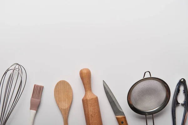 Top view of cooking utensils on grey background — Stock Photo