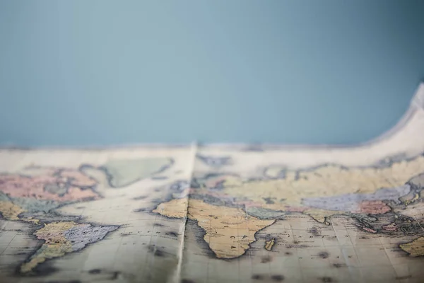 Selective focus of world map with copy space isolated on blue — Stock Photo