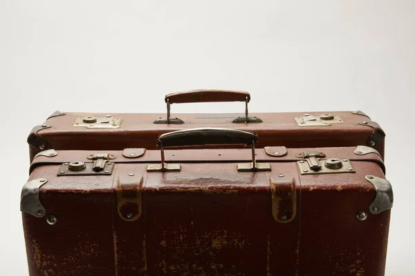 Brown suitcases with copy space isolated on grey — Stock Photo