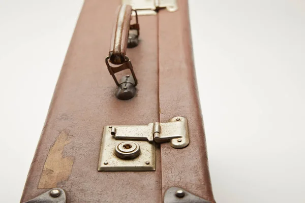 Close up of brown suitcase isolated on grey — Stock Photo