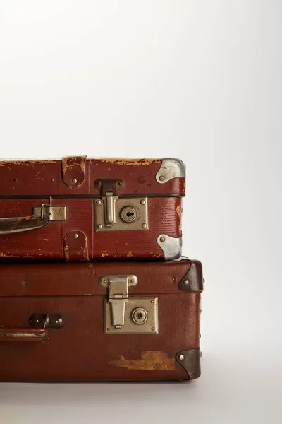 Retro brown suitcases on grey background with copy space — Stock Photo