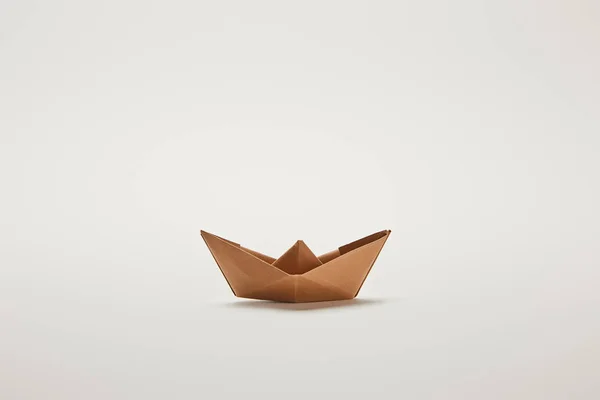 Paper boat on grey background with copy space — Stock Photo