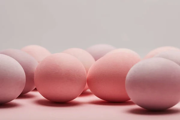 Easter eggs on grey background with copy space — Stock Photo