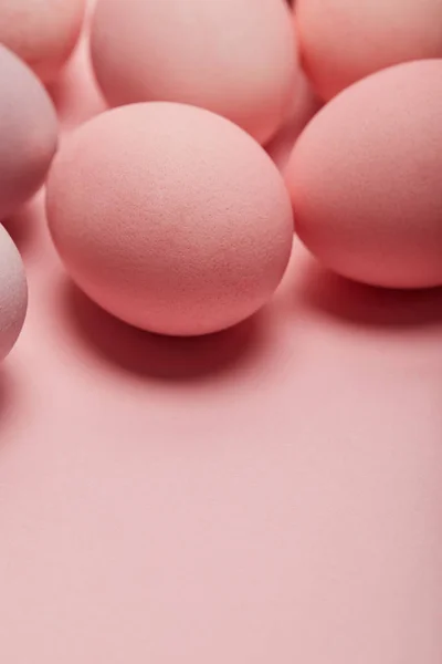 Easter eggs on pink background with copy space — Stock Photo