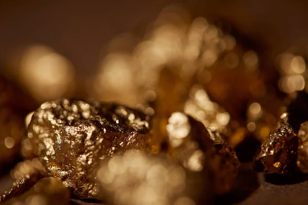 Selective focus of golden stones with blurred background — Stock Photo