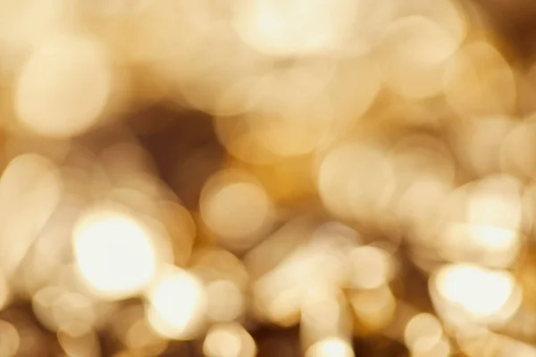 Bright blurred twinkles with golden sparkling lights — Stock Photo