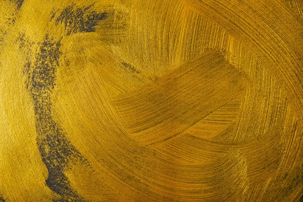 Différents coups de pinceau dorés sur fond texturé foncé — Photo de stock