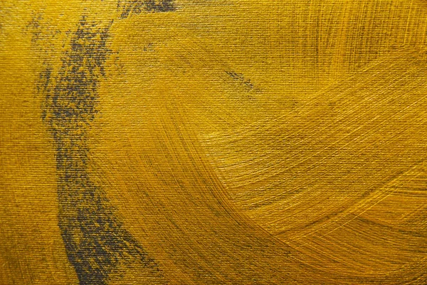 Brushstrokes of golden paint on grey background — Stock Photo