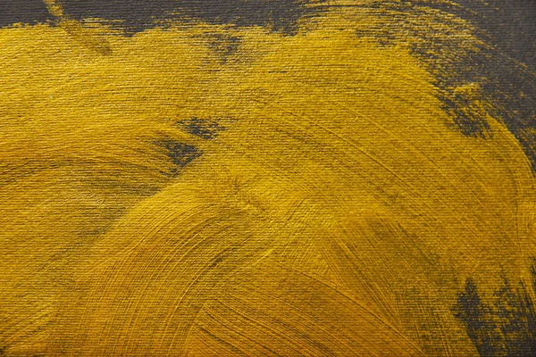 Different brushstrokes of golden paint on grey background — Stock Photo