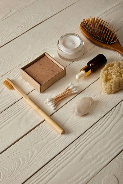 Flat lay of various hygiene and care items on white wooden surface, zero waste concept — Stock Photo