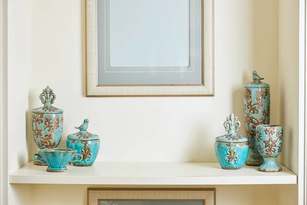 Picture frame and turquoise set on surface — Stock Photo