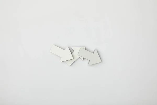 Top view of grey and white pointers on grey background — Stock Photo