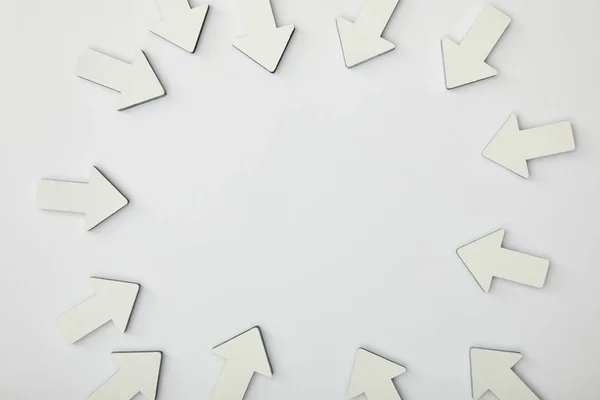 Top view of circle with white pointers on grey background — Stock Photo