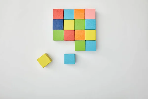 Top view of multicolored blocks on grey background — Stock Photo