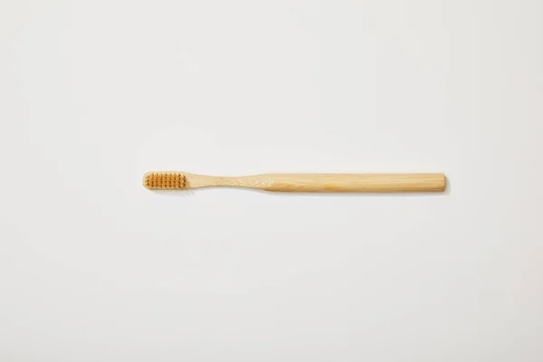 Top view of bamboo toothbrush on white background — Stock Photo
