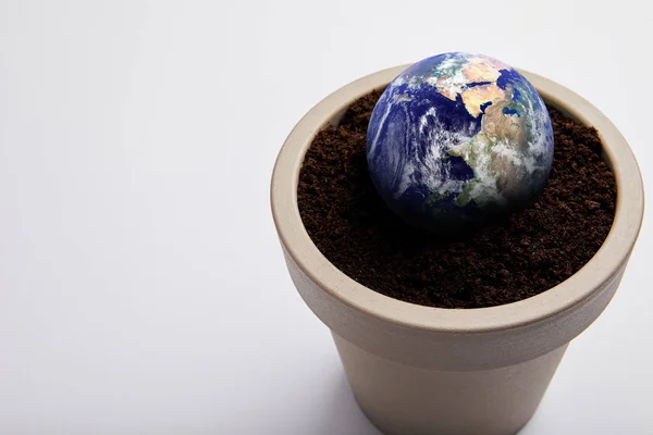 Planet model placed on flowerpot with soil, earth day concept — Stock Photo