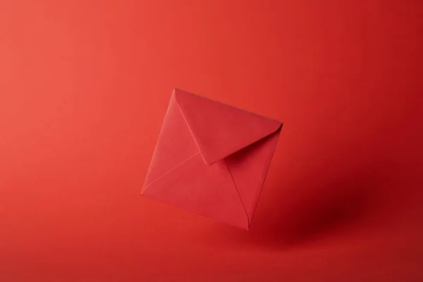 Bright, colorful and empty envelope on red background with copy space — Stock Photo