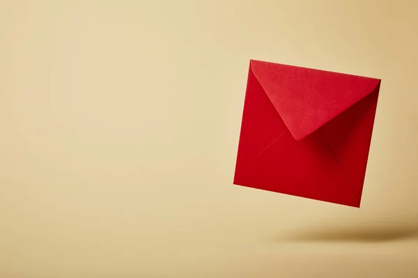 Red and bright envelope on colorful and yellow background with copy space — Stock Photo