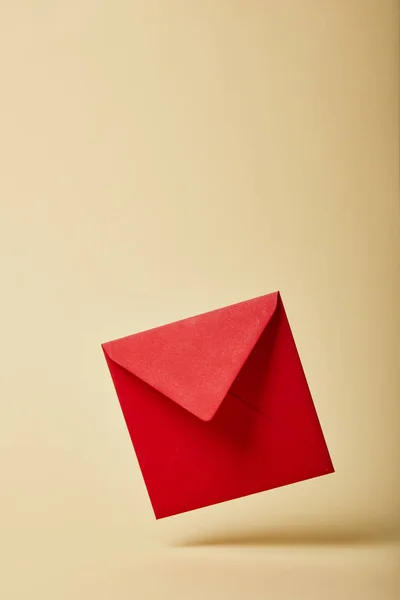 Red and bright envelope on colorful and yellow background with copy space — Stock Photo