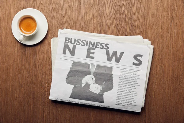 Top view of business newspaper near cup with coffee — Stock Photo