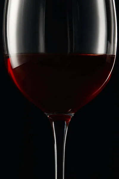 Glass of burgundy red wine isolated on black — Stock Photo