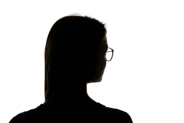 Силует жінки в окулярах дивиться ізольовано на білому — стокове фото