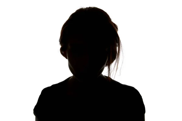 Silhouette einer Frau, die isoliert auf weiß in die Kamera blickt — Stockfoto