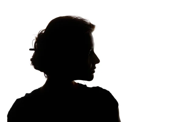 Silhouette di donna pensierosa guardando lontano isolato su bianco — Foto stock