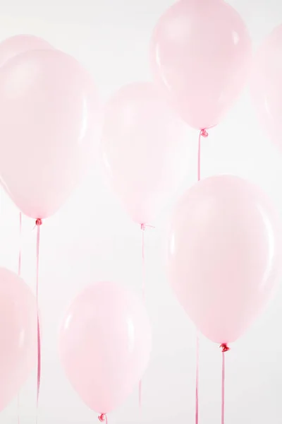 Background with pink festive air balloons on white — Stock Photo