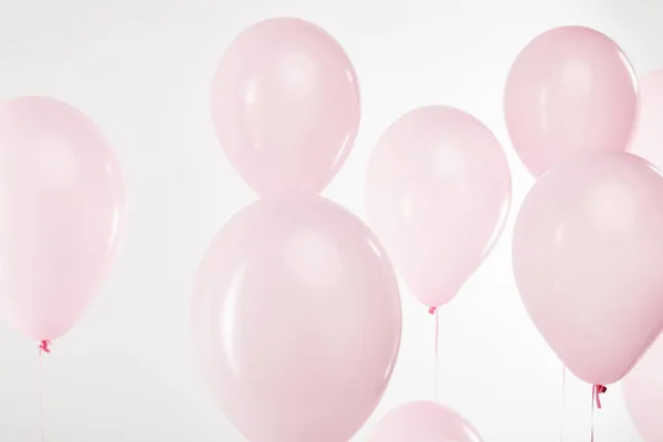 Background with decorative floating pink air balloons on white — Stock Photo