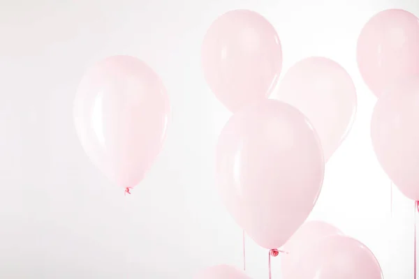 Background with decorative pink air balloons on white — Stock Photo