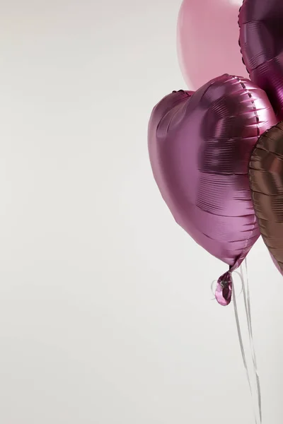 Heart-shaped pink balloons isolated on white with copy space — Stock Photo