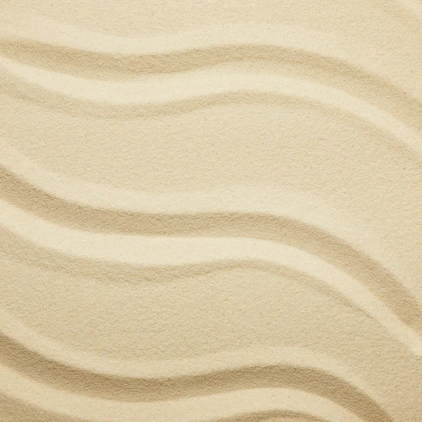 Gros plan de plage de sable texturé doré en été — Photo de stock