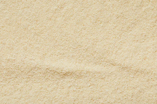 Vista superior de superfície de areia dourada e texturizada na praia no verão — Fotografia de Stock