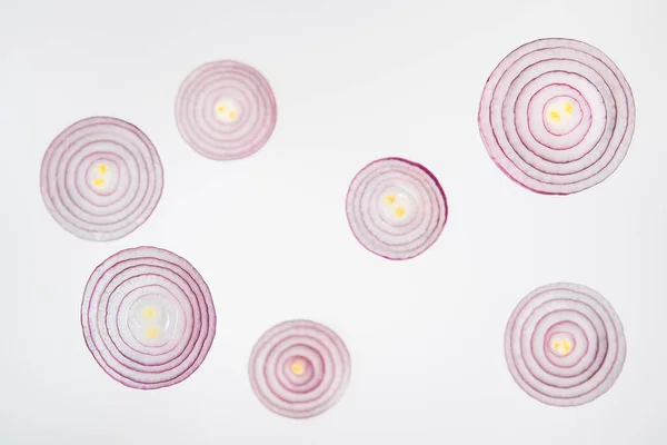 Fresh ripe sliced red onions on grey background — Stock Photo