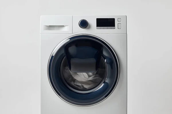 Modern washing machine with black display isolated on grey — Stock Photo